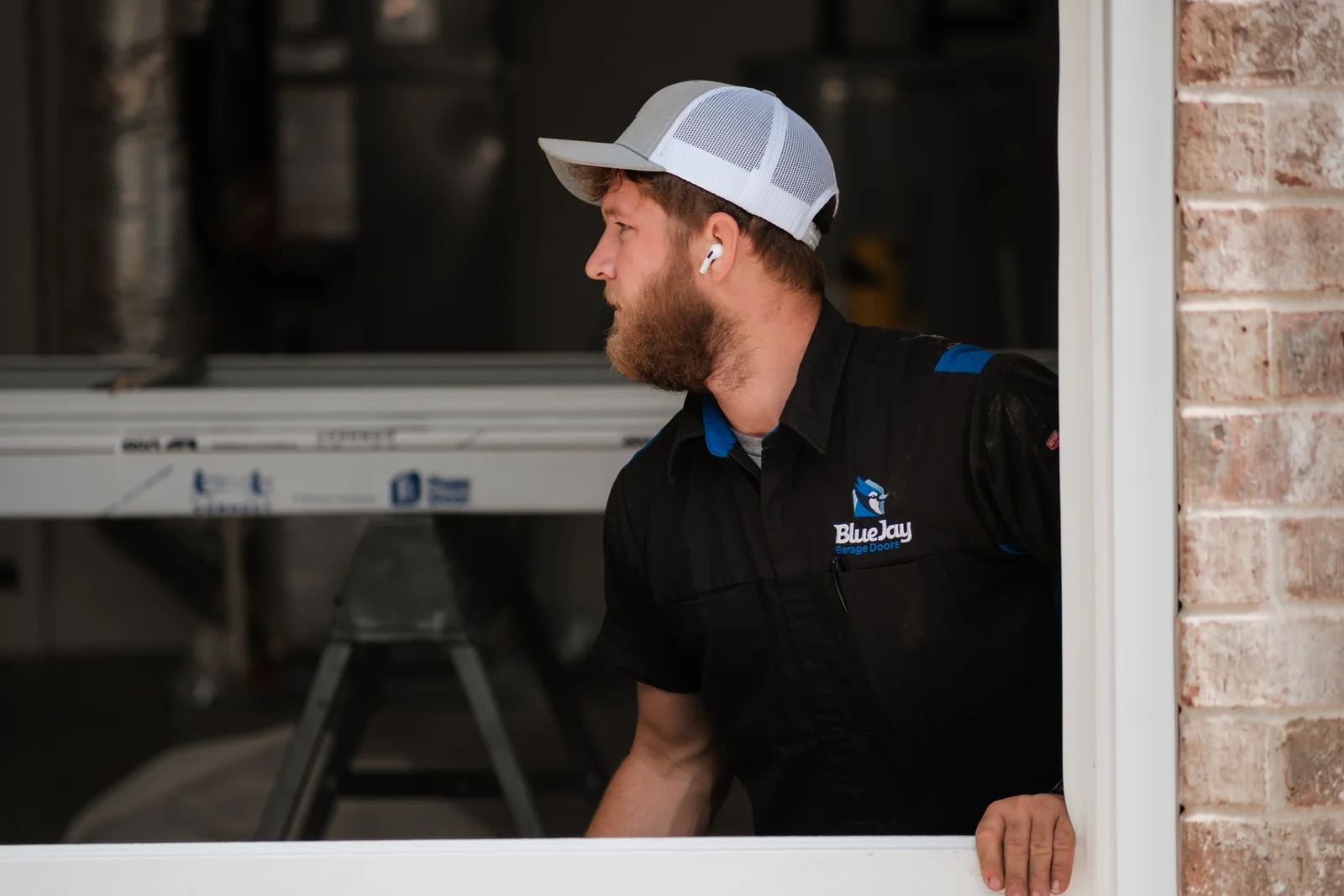 Blue Jay installer looking out through a garage door opening during an installation