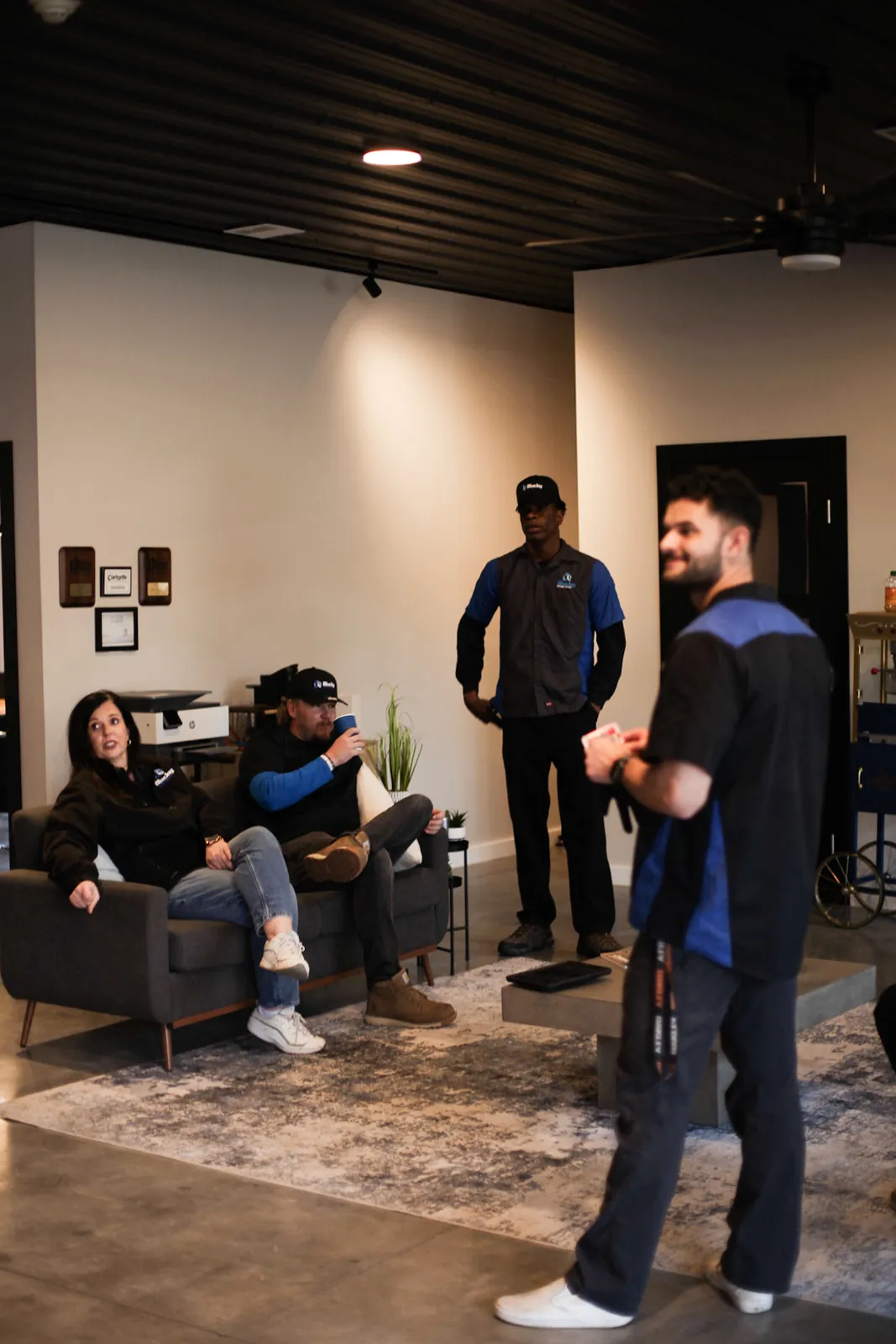 Blue Jay team members talking together in the office
