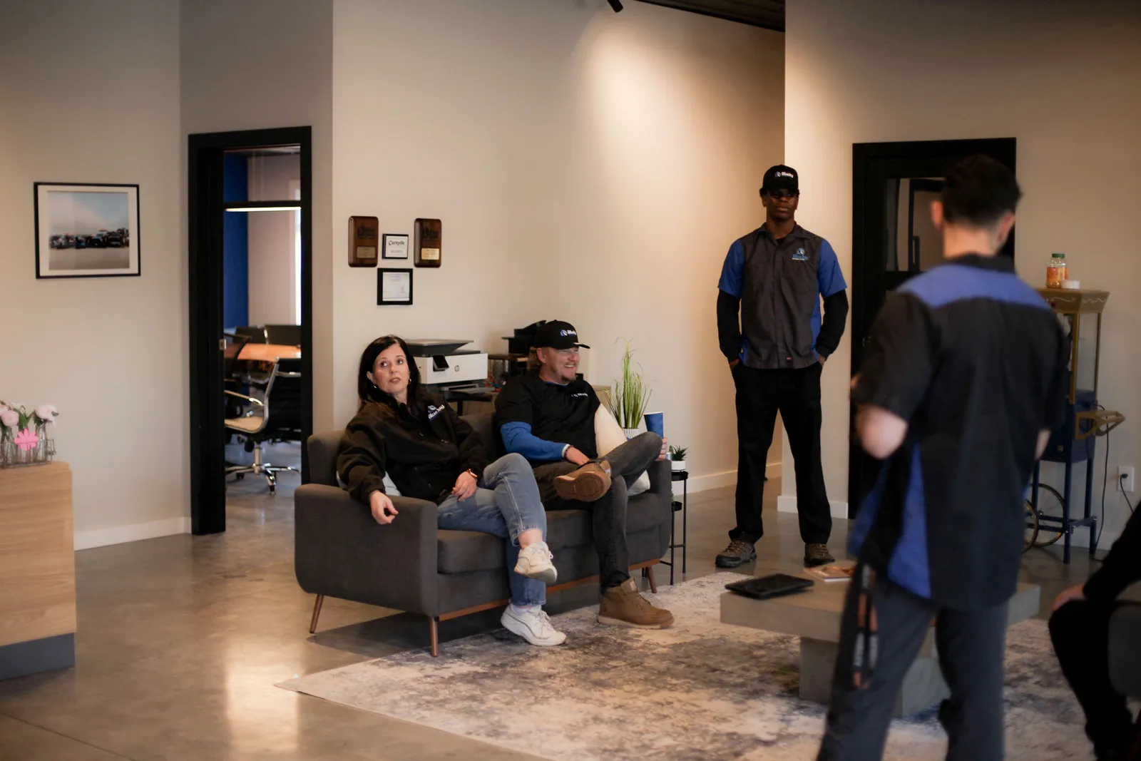 Blue Jay team members meeting in the office seating area