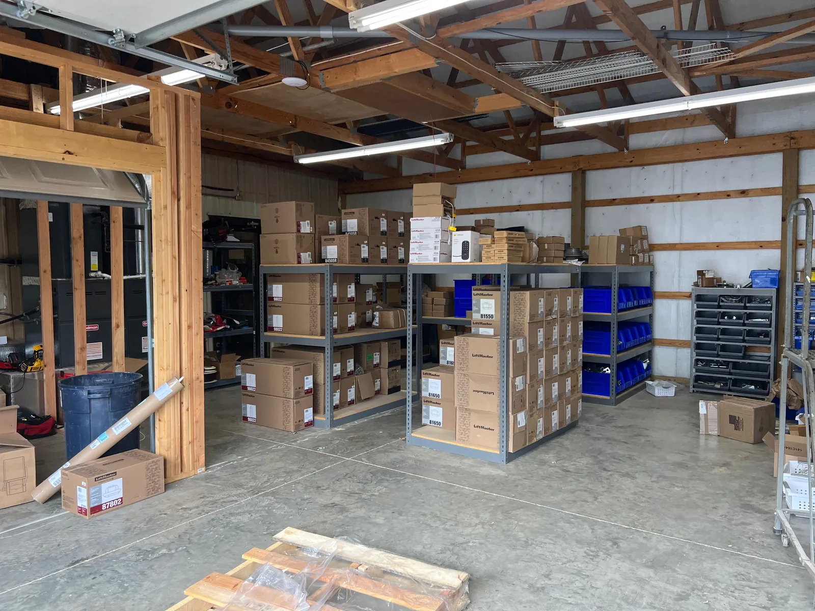 Door sections and hardware stored inside the Blue Jay warehouse