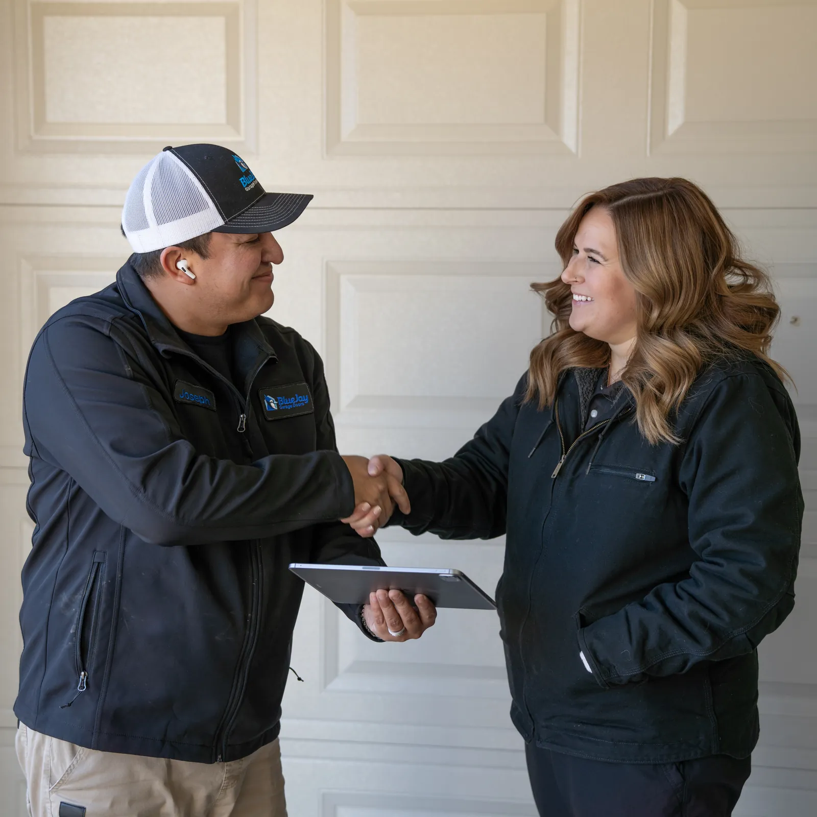 Blue Jay technician shaking hands with a homeowner