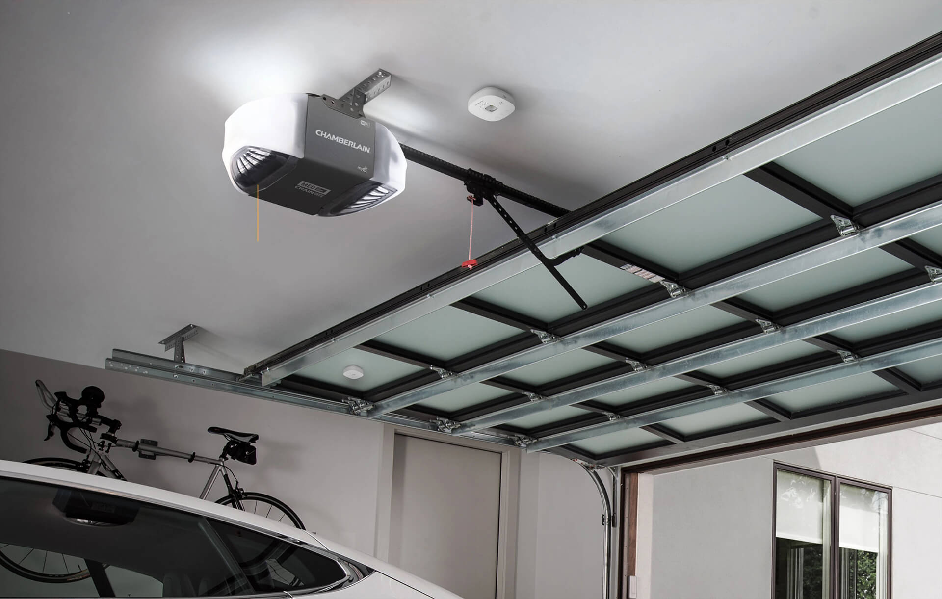 LiftMaster Ceiling & Sensor_comp Blue Jay Garage Doors repair man inspecting garage door