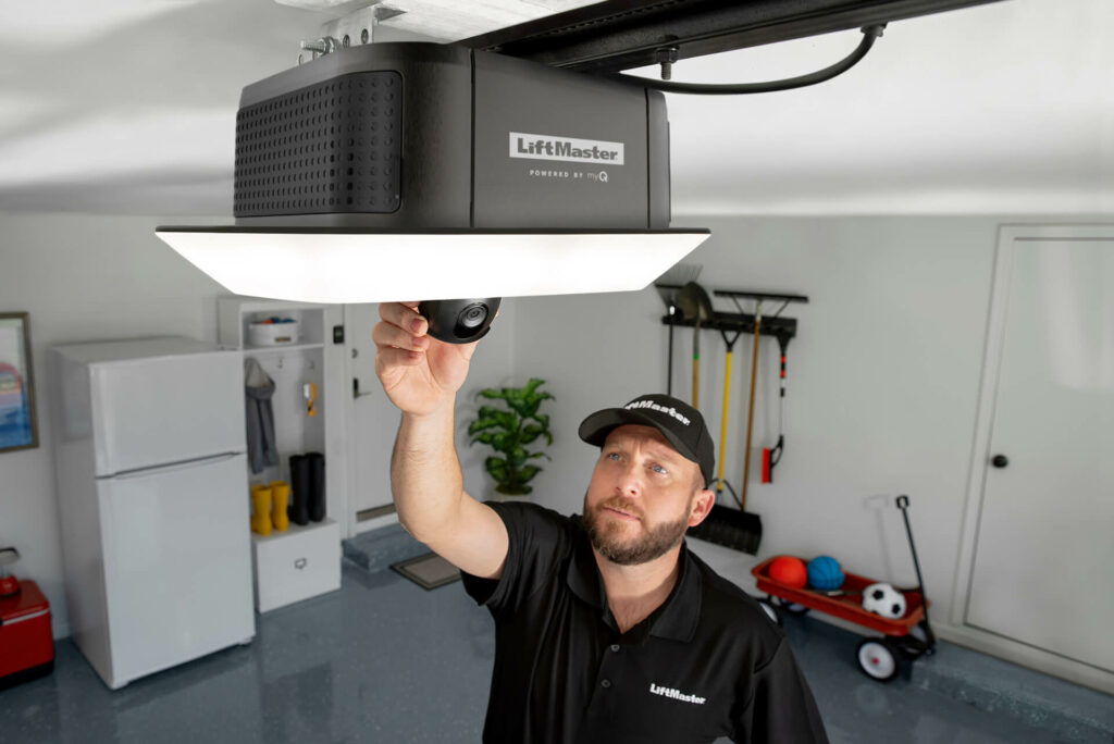 garage door opener repair hero_comp Blue Jay Garage Doors repair man inspecting garage door