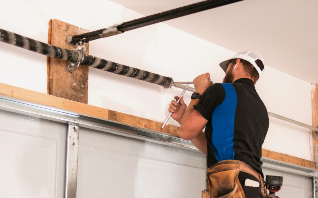 Blue Jay Garage Doors Technician repairing a Garage Door Spring