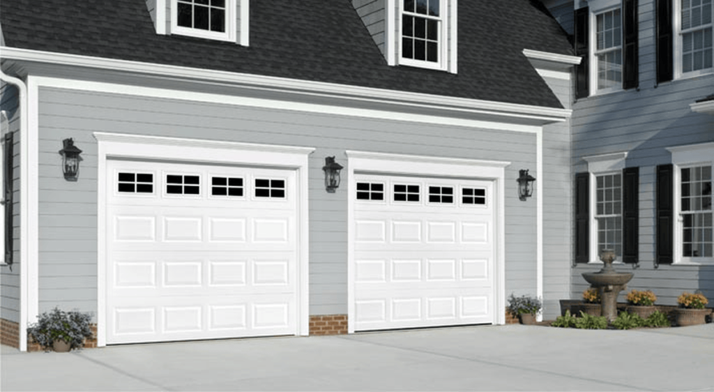 image7 Blue Jay Garage Doors Technician inspecting a garage door and garage door opener