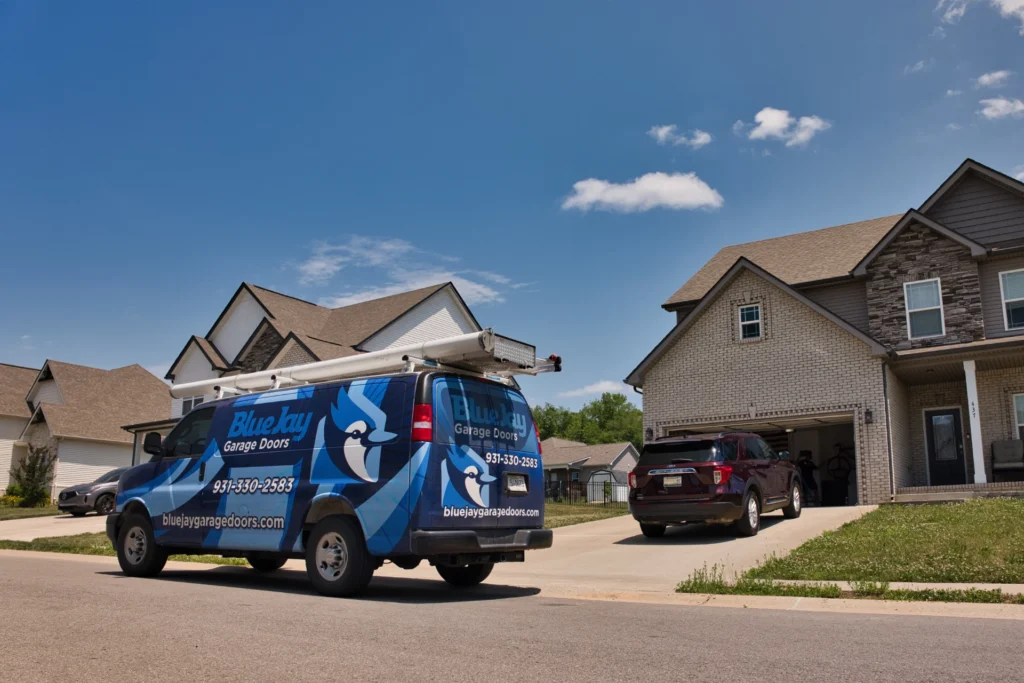 Blue Jay Garage Doors van in front of a house