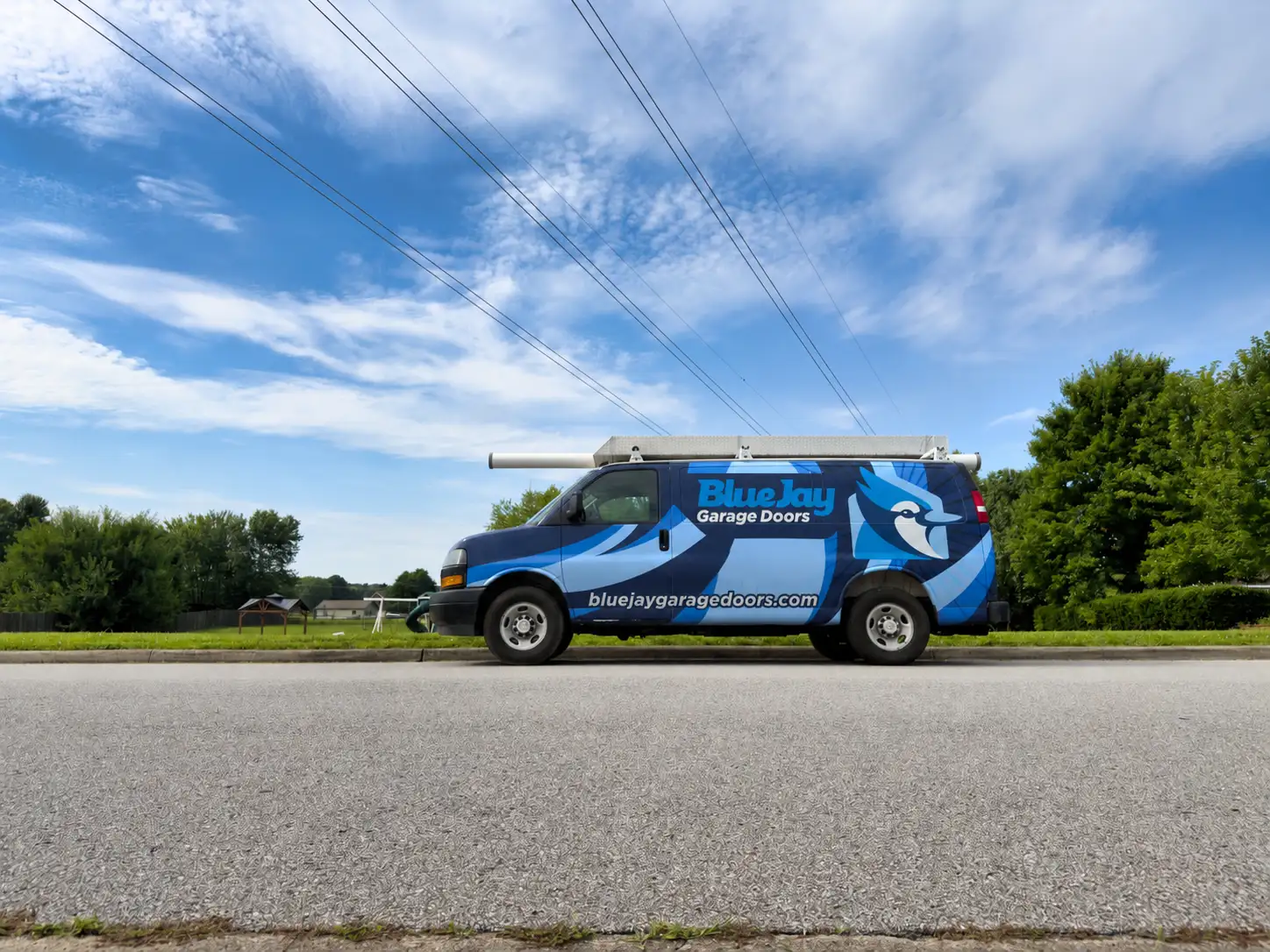 Garage Door Won't Close All the Way? 6 Causes and Which Ones You Can Fix Yourself Blue Jay Garage Doors service van in Clarksville, Tennessee