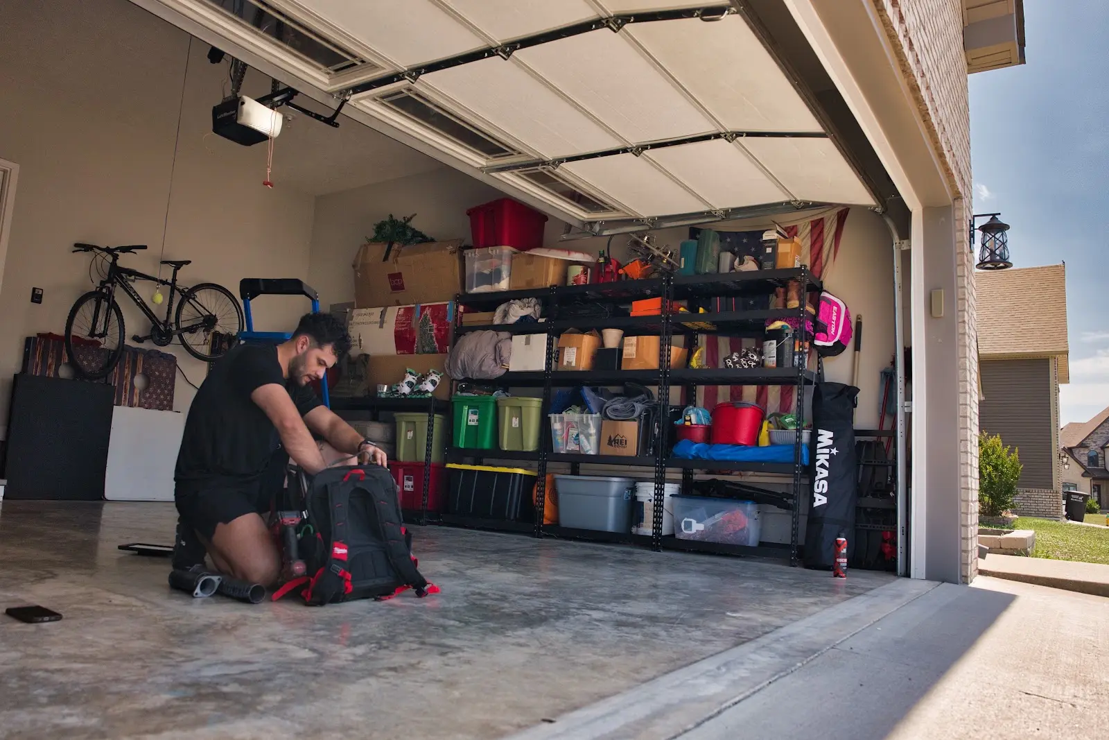 Garage Door Won't Close All the Way? 6 Causes and Which Ones You Can Fix Yourself Blue Jay technician preparing for a garage door inspection
